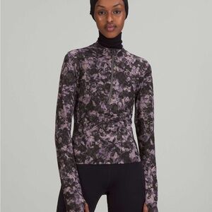 Purple and black lululemon Luxtreme Running Half-Zip.